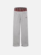 Black wide-leg jogger trousers with checked waistband and drawcords