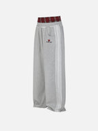 Black wide-leg jogger trousers with checked waistband and drawcords