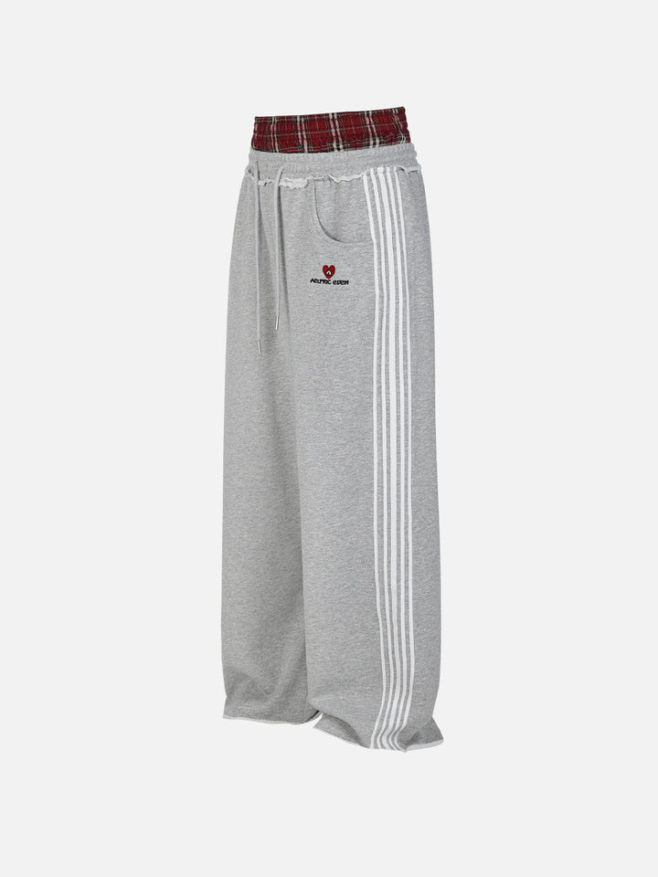 Black wide-leg jogger trousers with checked waistband and drawcords