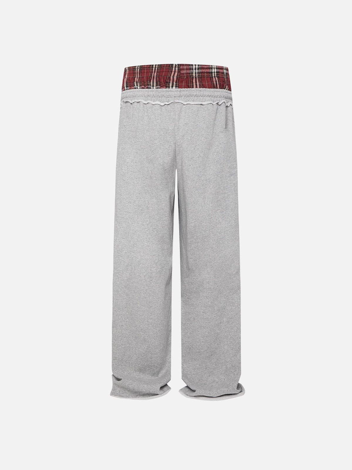 Black wide-leg jogger trousers with checked waistband and drawcords