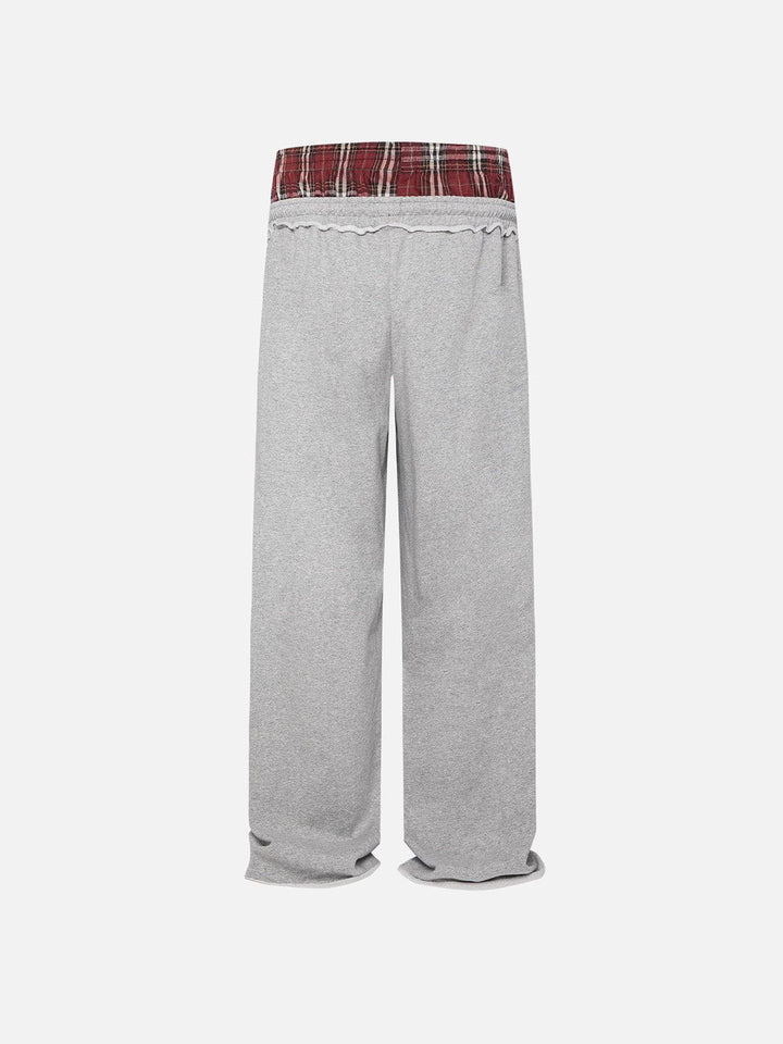 Black wide-leg jogger trousers with checked waistband and drawcords