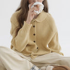 Women's knitted cardigan with rounded collar, long sleeves and button front