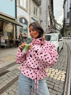 Women's pink cropped polka dot trench coat with high collar and waist tie