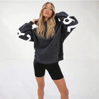 Women's graphic print hoodie with hood and bold back lettering