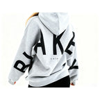 Women's graphic print hoodie with hood and bold back lettering