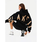 Women's graphic print hoodie with hood and bold back lettering