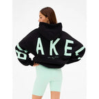 Women's graphic print hoodie with hood and bold back lettering