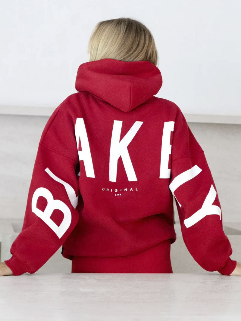Women's graphic print hoodie with hood and bold back lettering