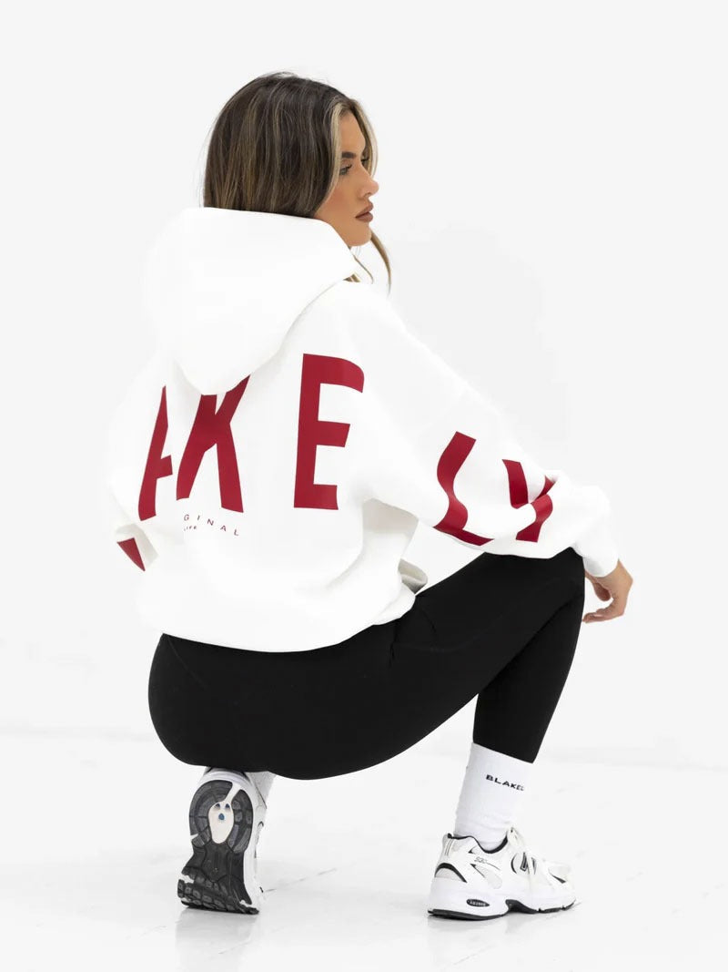 Women's graphic print hoodie with hood and bold back lettering