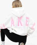 Women's graphic print hoodie with hood and bold back lettering