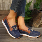 Women's flat loafers with decorative metal buckles and rounded toes