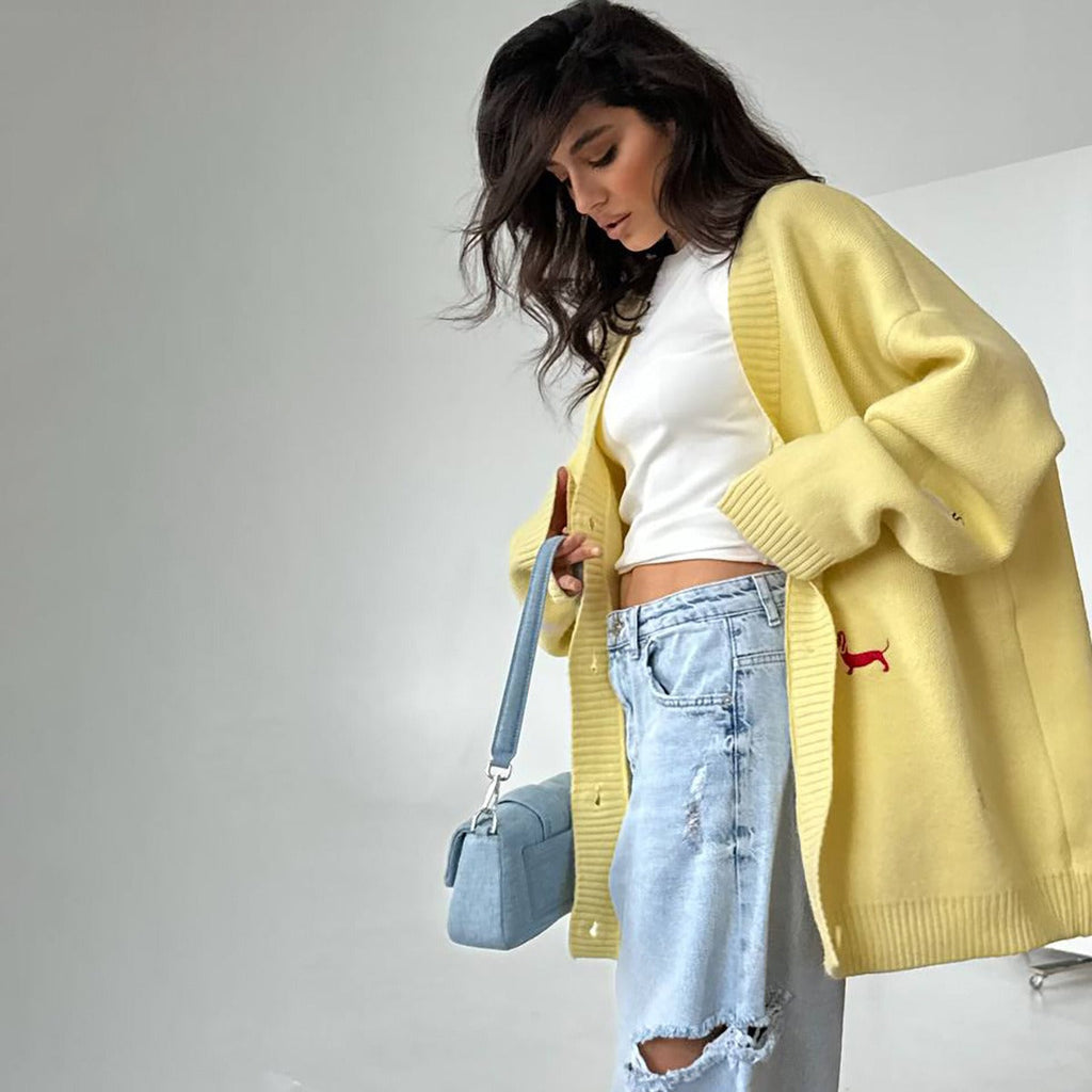Women's oversized cable knit cardigan with buttons and embroidered motifs