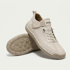 High-top lace-up sneakers with side strap detail and textured flat soles
