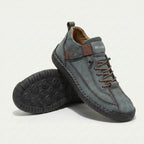 High-top lace-up sneakers with side strap detail and textured flat soles