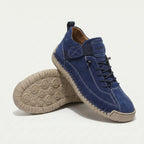 High-top lace-up sneakers with side strap detail and textured flat soles