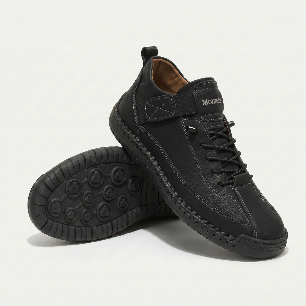 High-top lace-up sneakers with side strap detail and textured flat soles