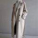 Women's long trench coat with lapels, belt and double-breasted buttons