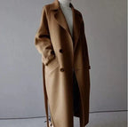 Women's long trench coat with lapels, belt and double-breasted buttons