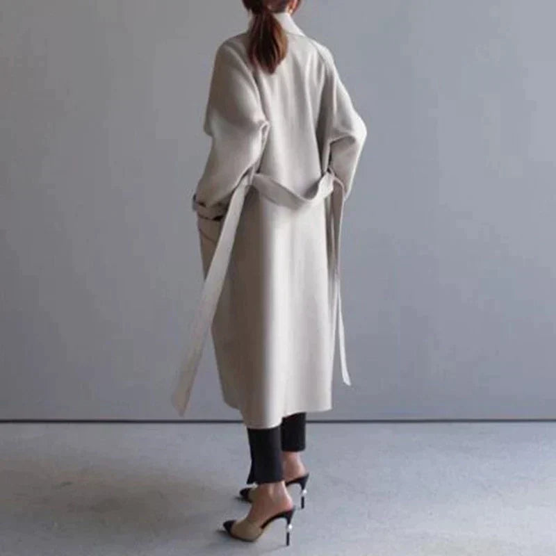 Women's long trench coat with lapels, belt and double-breasted buttons