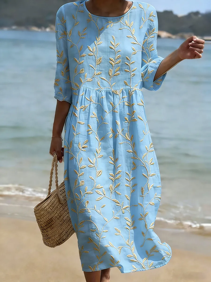 Women's blue embroidered midi dress with leaf motifs