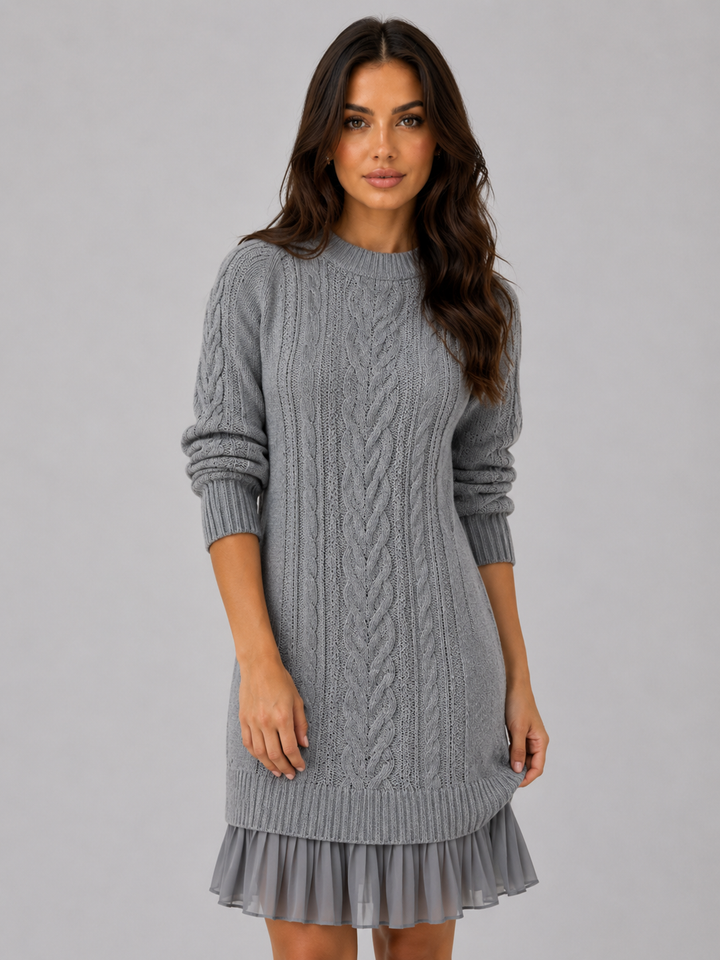 Women's grey cable knit jumper dress with pleated hem and crew neck