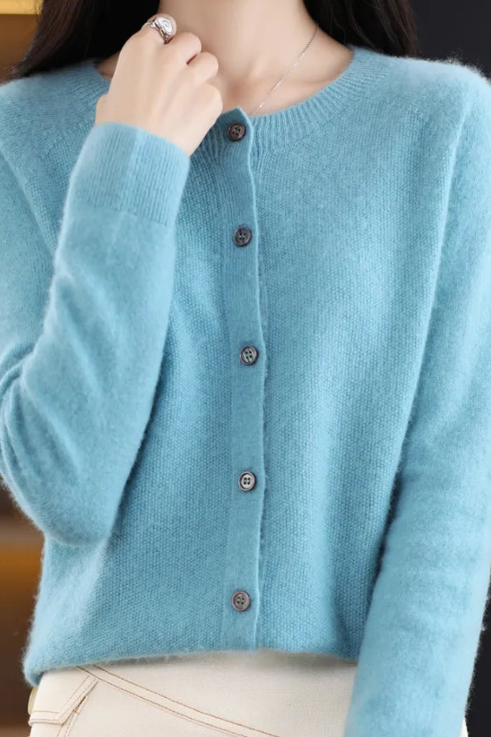 Women's long-sleeve button-front cardigan with round neckline and ribbed trims