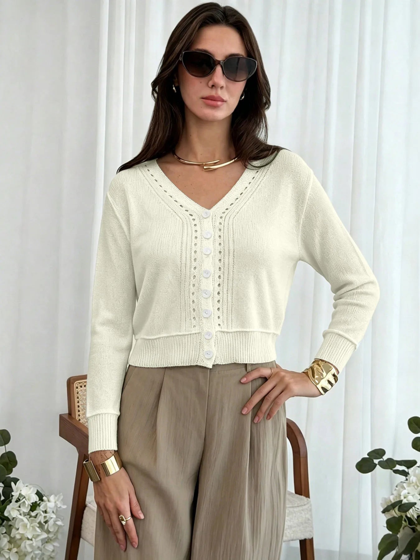 Women's cream cropped cardigan with V-neckline and eyelet knit detail