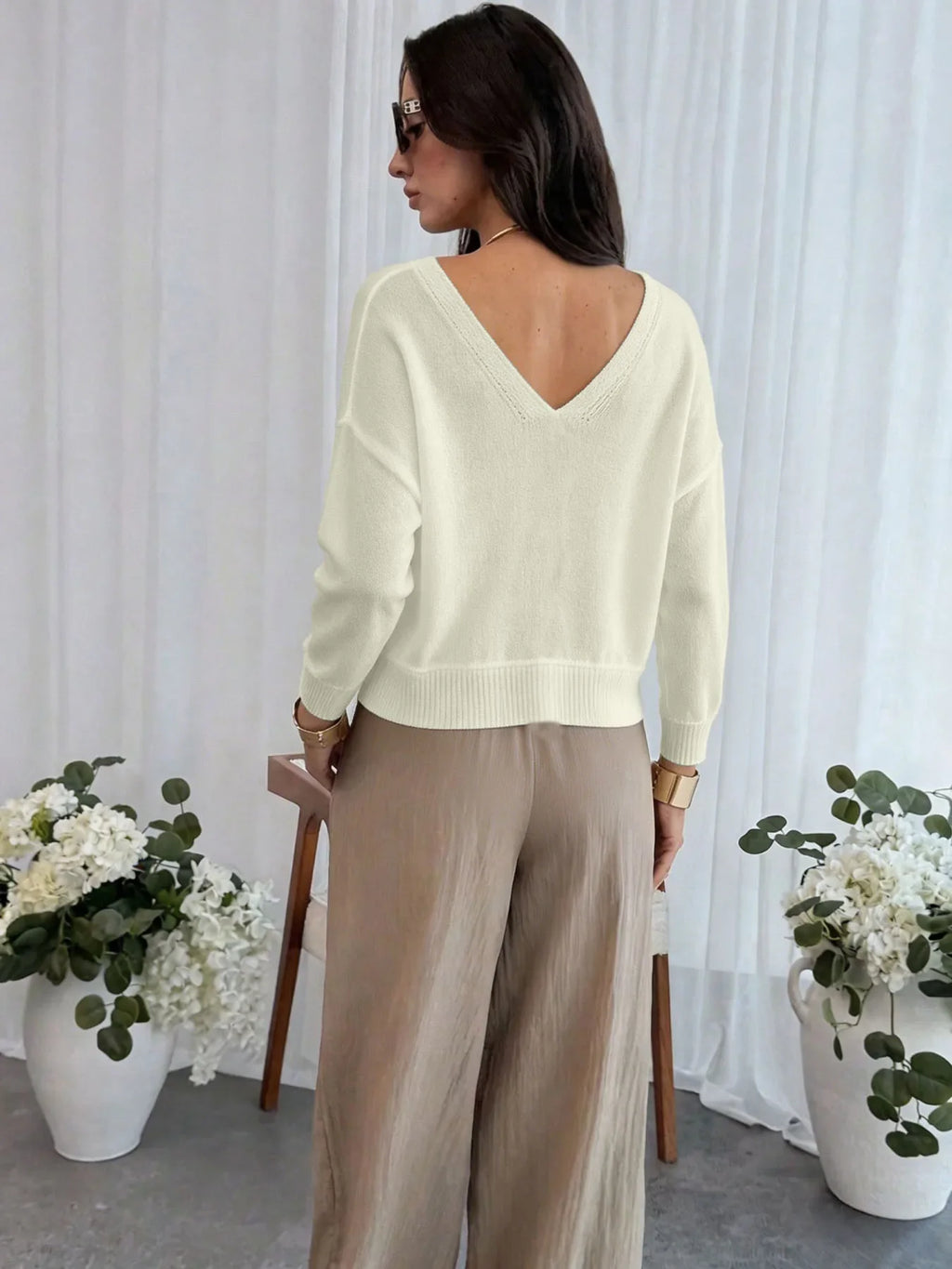 Women's cream cropped cardigan with V-neckline and eyelet knit detail