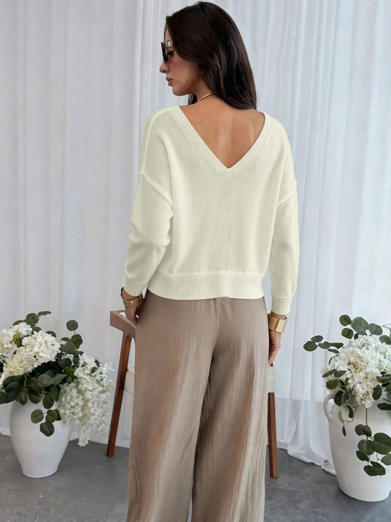 Women's cream cropped cardigan with V-neckline and eyelet knit detail