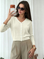Women's cream cropped cardigan with V-neckline and eyelet knit detail