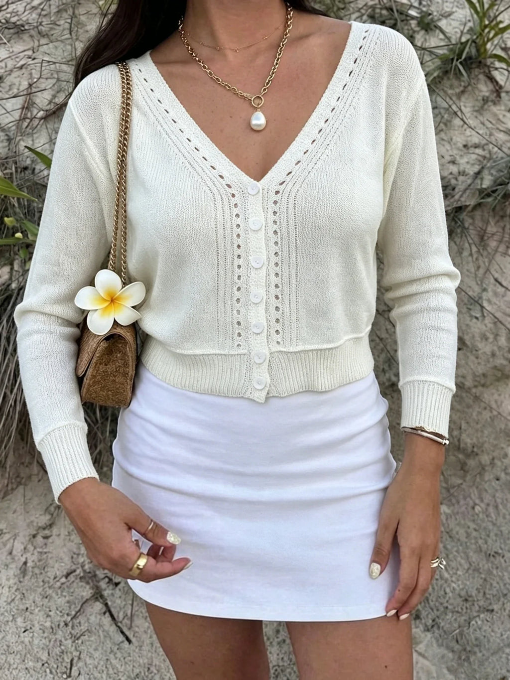 Women's cream cropped cardigan with V-neckline and eyelet knit detail