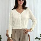 Women's cream cropped cardigan with V-neckline and eyelet knit detail