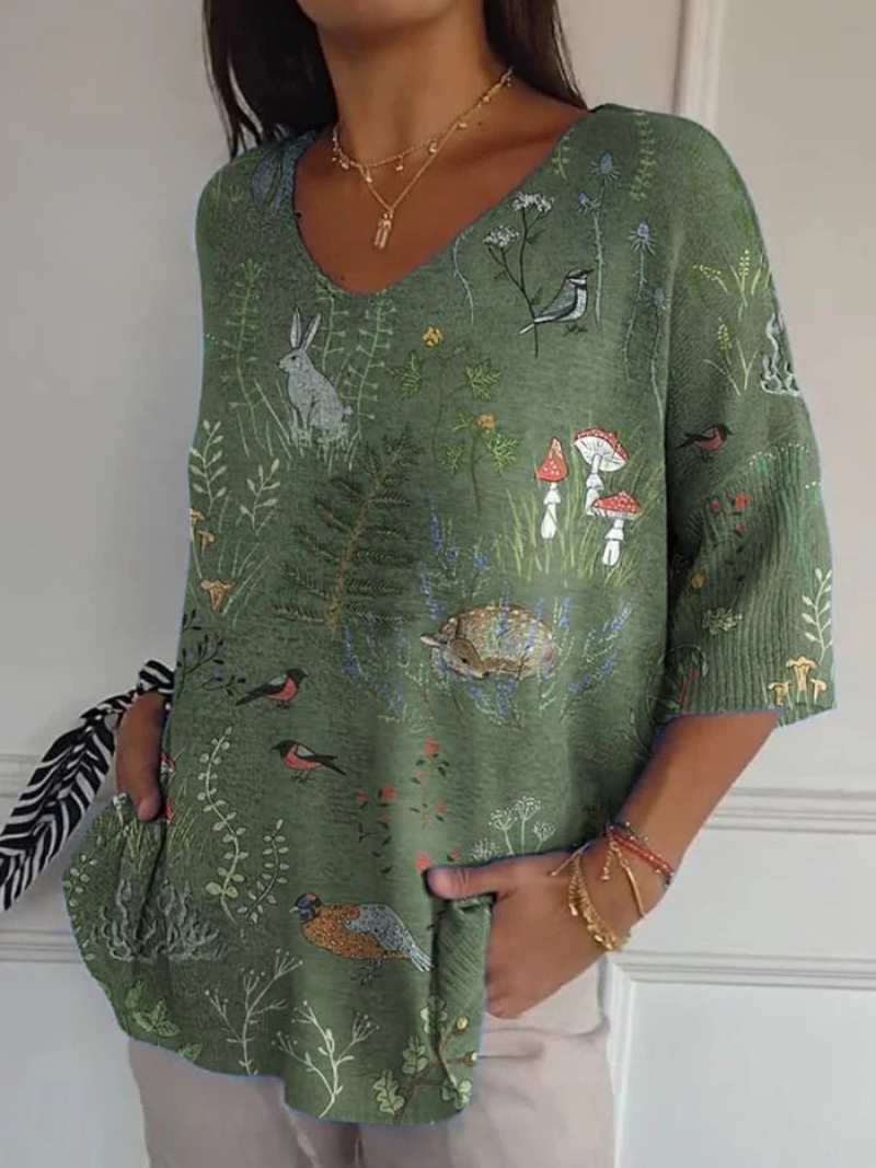 Women's green V-neck sweater with woodland animals, birds, mushrooms and foliage print