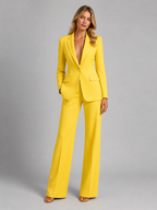 Women's tailored blazer and wide-leg trousers set with notched lapels and flap pockets