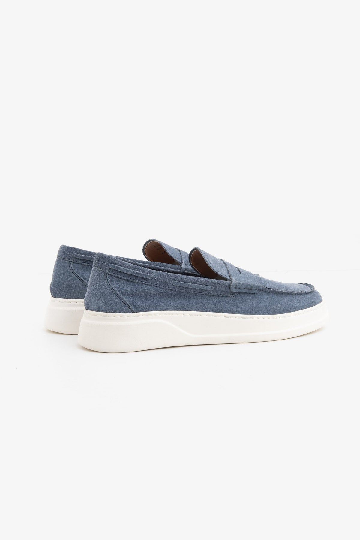 Blue moccasin loafers with penny straps and white platform soles
