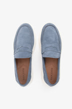 Blue moccasin loafers with penny straps and white platform soles
