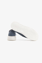 Blue moccasin loafers with penny straps and white platform soles