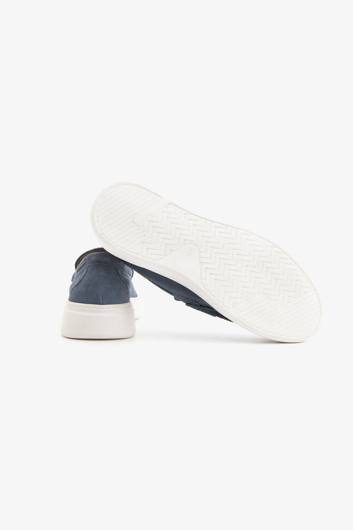 Blue moccasin loafers with penny straps and white platform soles