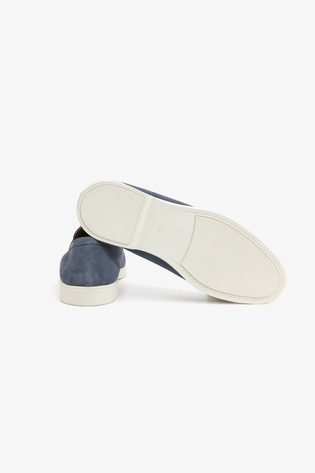 Blue men's slip-on loafers with moccasin stitching and cream flat soles