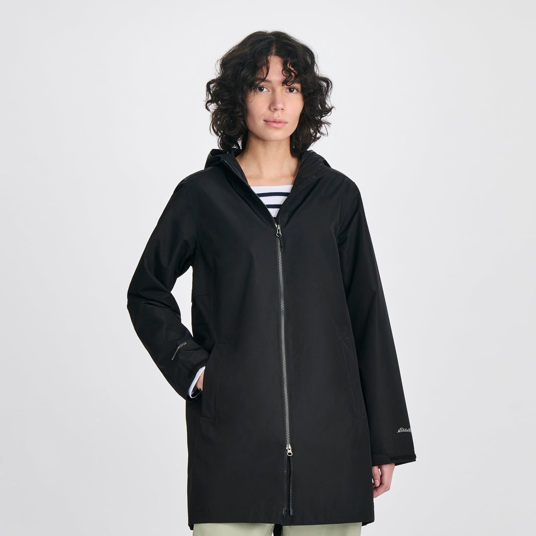 Women's hooded mid-thigh trench coat with long sleeves and zip fastening