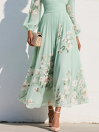 Light green floral pleated midi dress with V-neck and long sleeves