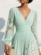 Light green floral pleated midi dress with V-neck and long sleeves