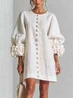 Textured button-down mini dress with long balloon sleeves and floral cuffs