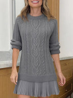 Women's cable-knit mini sweater dress with crew neck, long sleeves and pleated hem