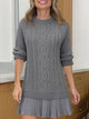 Women's cable-knit mini sweater dress with crew neck, long sleeves and pleated hem
