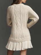 Women's cable-knit mini sweater dress with crew neck, long sleeves and pleated hem