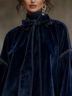 Women's navy velvet mini dress with bow and lantern sleeves