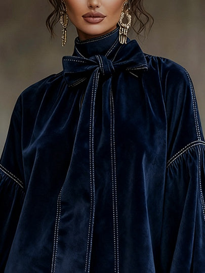 Women's navy velvet mini dress with bow and lantern sleeves