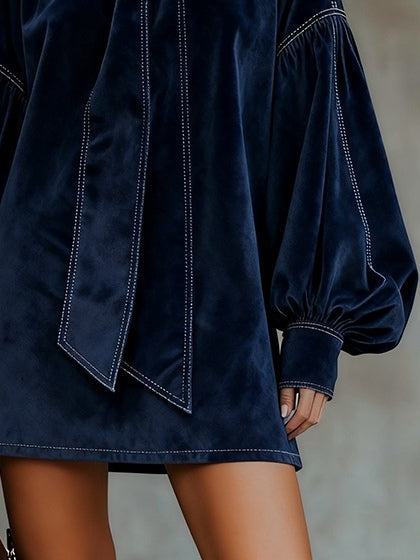 Women's navy velvet mini dress with bow and lantern sleeves