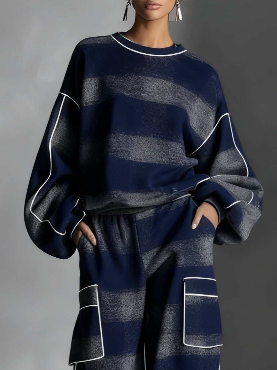 Women's striped sweatshirt and wide-leg trousers set with contrast piping and patch pockets